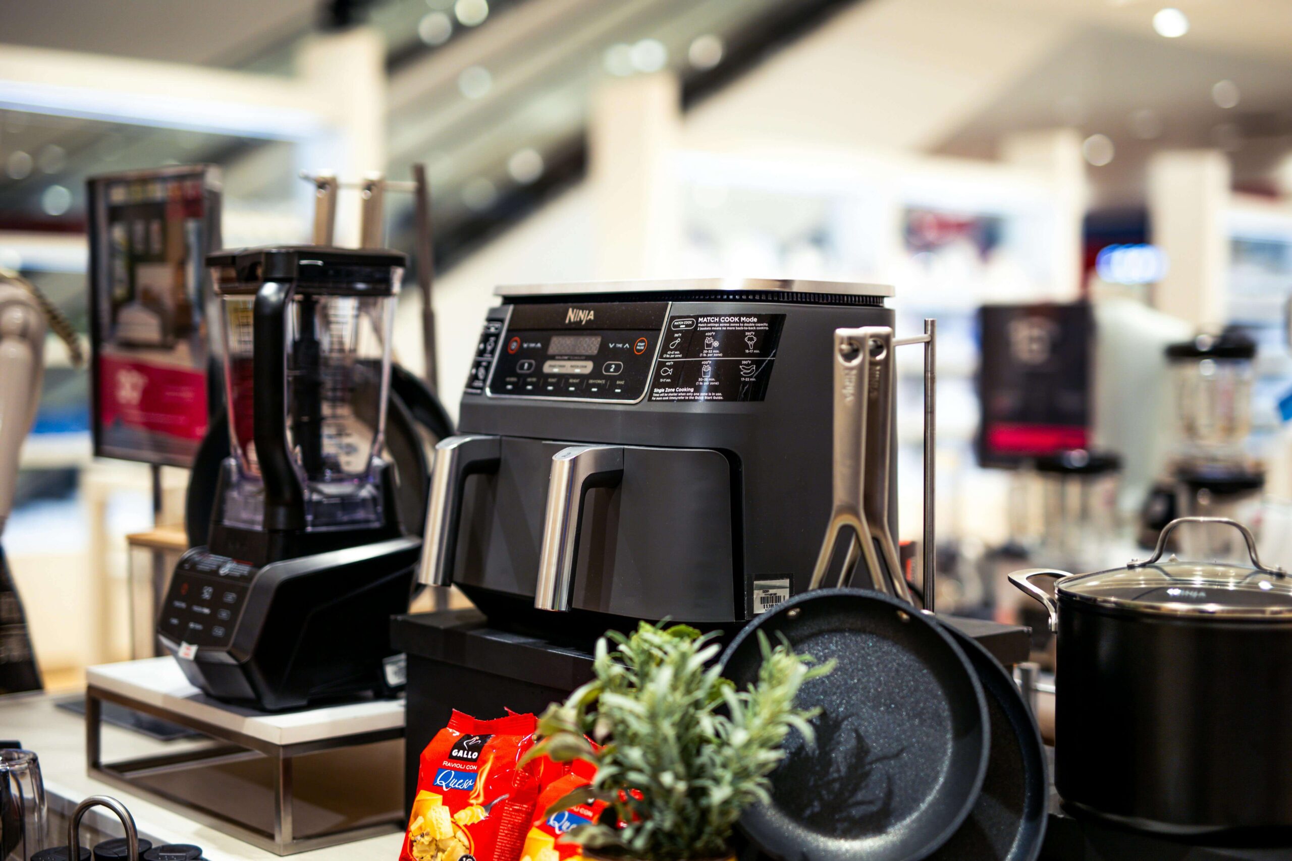 Modern kitchen countertop with premium small appliances including a coffee maker blender and toaster