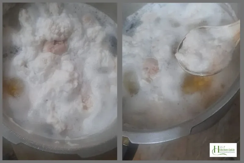 Skimming off white foam from boiling chicken and chana dal in a pressure cooker.